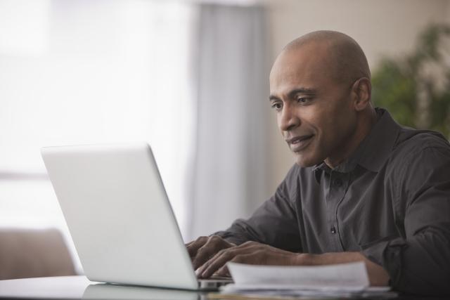 Member using a computer to book a ride