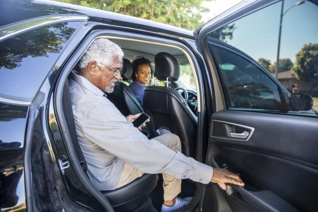 Member getting in a car