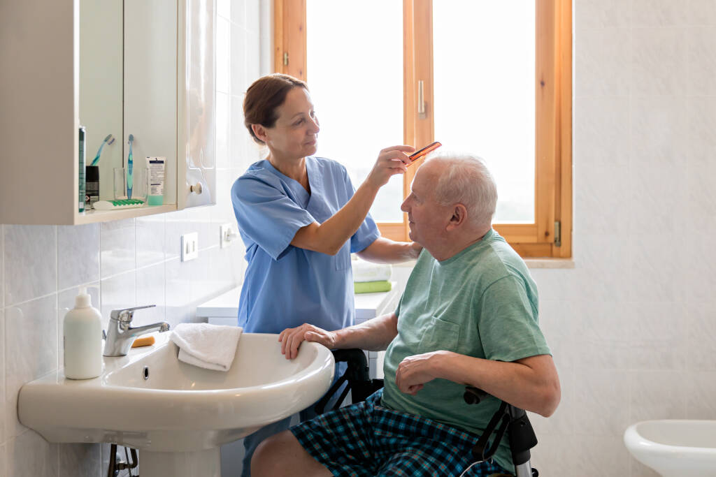 Caregiver assisting a member with daily acitvities