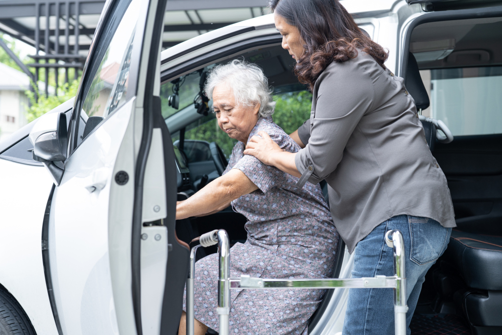Transportation provider assisting a member out of their car
