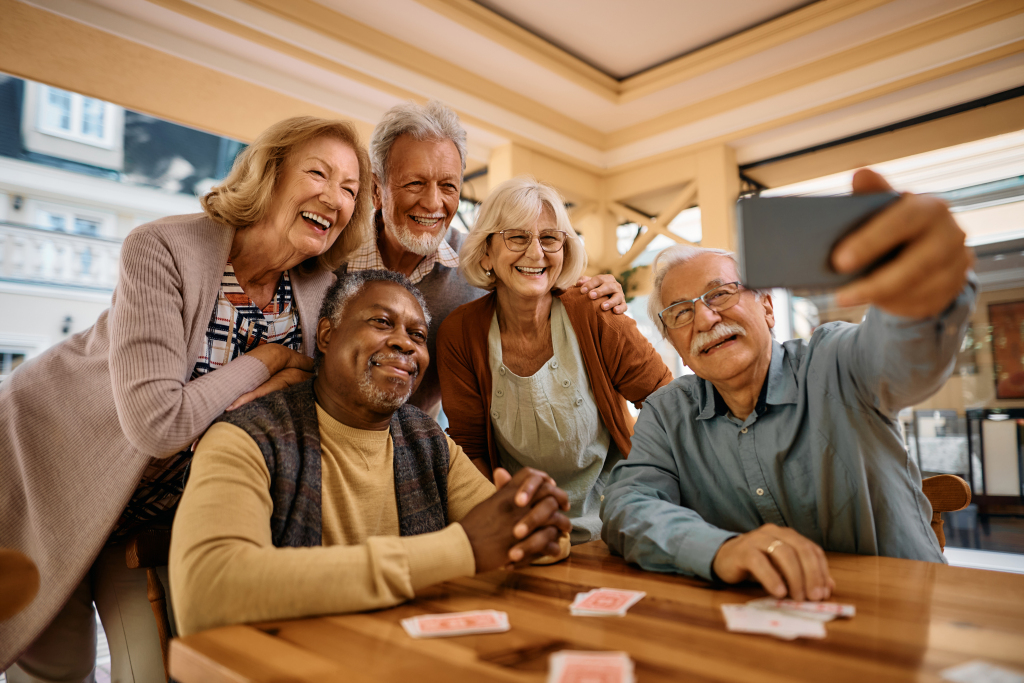 Cheerful senior having fun while taking selfie
